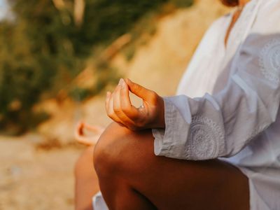 Close-up shot of hands in a specific yoga mudra.