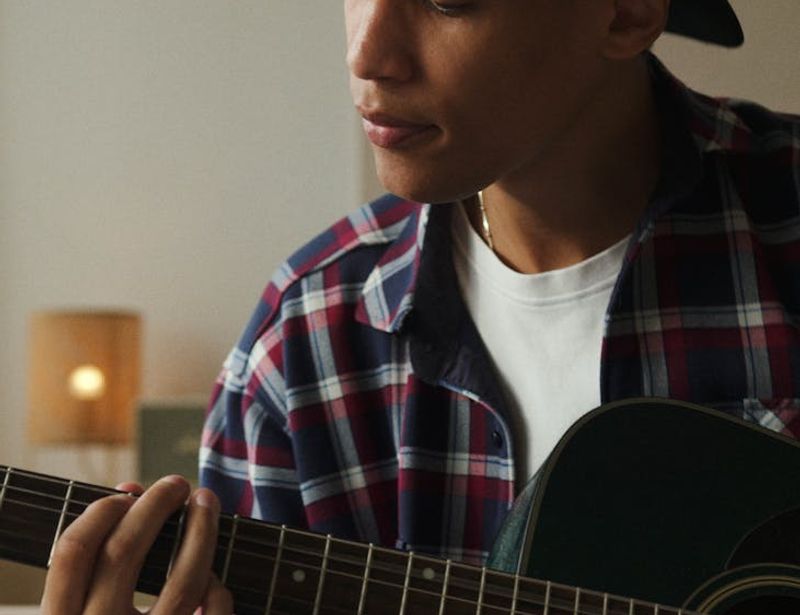 Main lifestyle shot showing a person in a calm, focused state during practice.